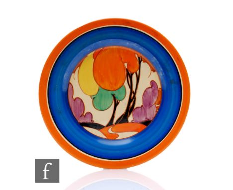 Clarice Cliff - Autumn (Variant) - A circular plate circa 1930, hand painted with a stylised tree and cottage landscape with 