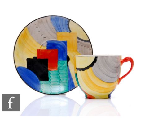 Susie Cooper - Grays Pottery - A Cubist pattern tea cup and saucer decorated with brightly coloured abstract motifs, printed 