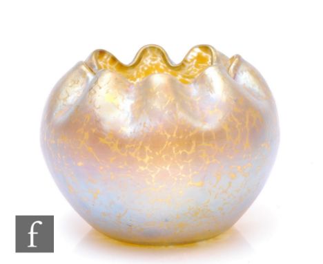 Loetz - An early 20th Century Candia Papillon glass rose bowl, circa 1900, of globe form with inverted frill rim, decorated w