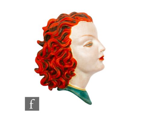 Goldscheider - A 1930s Art Deco wall mask modelled as a female head in profile with orange curled hair and green dress, print