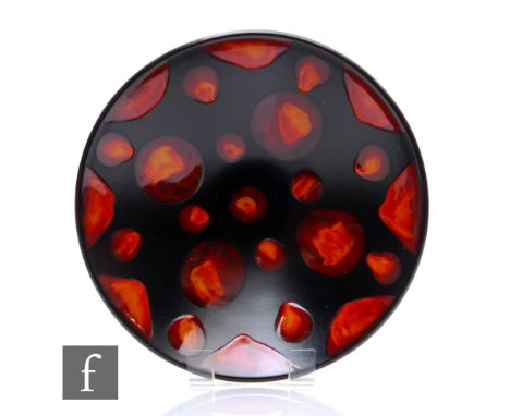 Poole Pottery - A large Galaxy pattern bowl, decorated with tonal red and orange living glaze spots over the matt black glaze