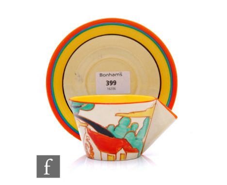 Clarice Cliff - Red Roofs - A Conical shape tea cup and saucer circa 1931, hand painted with a stylised farmhouse beneath a t