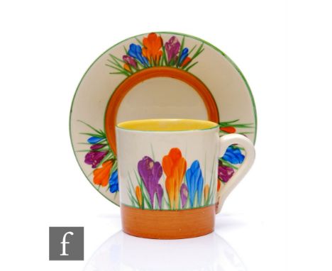 Clarice Cliff - Crocus - A Tankard shape coffee can and saucer circa 1931, hand painted with stylised Crocus sprays with yell