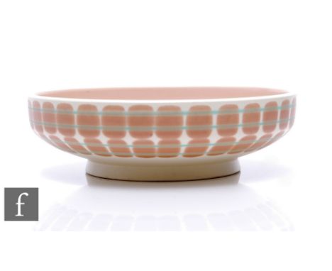 Poole Pottery - A 1950s Freefrom shape 345 bowl, circular footed form, painted with double band of stacked blocks and concent