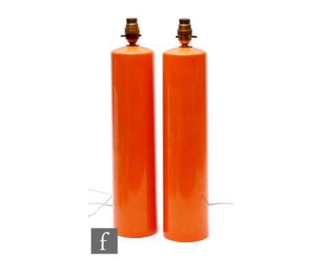 Unattributed maker - A pair of 1960s/70s lacquered ceramic orange lamp bases, of slender cylindrical form, heights 42cm. (2)
