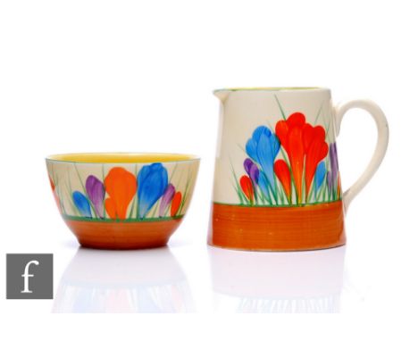 Clarice Cliff - Crocus - A Tankard shape milk jug and sugar bowl circa 1930, both hand painted with Crocus sprays with yellow