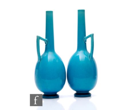 After Dr Christopher Dresser - Burmantofts - A pair of late 19th Century bottle vases of footed ovoid form with a tall slende