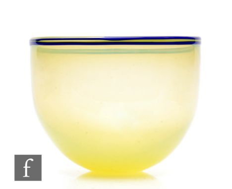 Gunnar Cyren - Orrefors - A post war glass bowl, circa 1966, of high sided circular section, in citron, with trails in blue t
