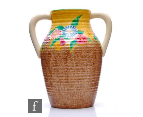 Clarice Cliff - Petunia - A double handled Lotus jug circa 1933, hand painted with a band of stylised flowers and foliage bet