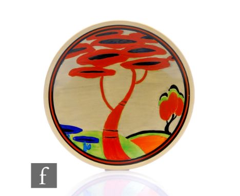 Clarice Cliff - Applique Red Tree - A circular dish form plate circa 1930, hand painted with a stylised tree landscape with r