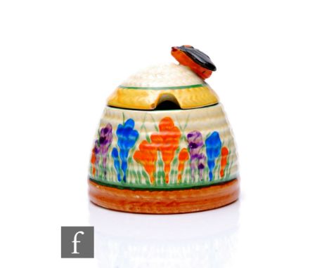 Clarice Cliff - Crocus - A small Beehive shape honey pot circa 1931, hand painted with Crocus sprays with green, yellow and b
