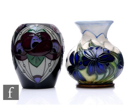 Rachel Bishop - Moorcroft Pottery - A Rennie Rose pattern vase, circa 2013, tubeline decorated over dark blue ground, impress