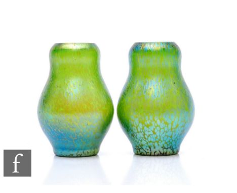 Loetz - A pair of early 20th Century Papillion vases of baluster form, mottled iridescence over green ground, height 9cm. (2)