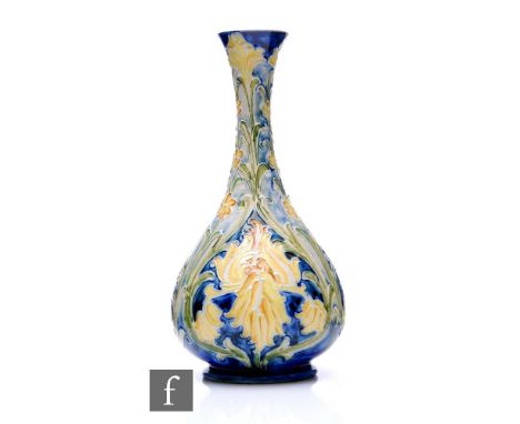 William Moorcroft - James Macintyre &amp; Co - A Florian range vase circa 1905, with stylised Iris, forget-me-nots and foliag