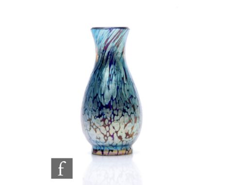 Loetz - An early 20th Century Cobalt Papillon miniature glass vase, circa 1900, of footed baluster form, decorated with mottl