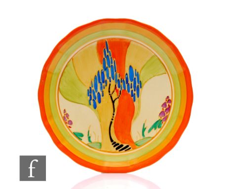 Clarice Cliff - Windbells - A circular wave edge plate circa 1933, hand painted with a stylised tree landscape with orange, y