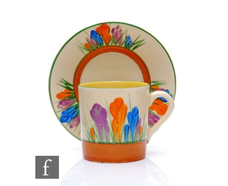 Clarice Cliff - Crocus - A Tankard shape coffee can and saucer circa 1931, hand painted with stylised Crocus sprays with yell