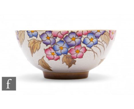 Charlotte Rhead - Bursley Ware - A 1930s Art Deco bowl of circular form, tubeline decorated with flowers and leaves, in tonal