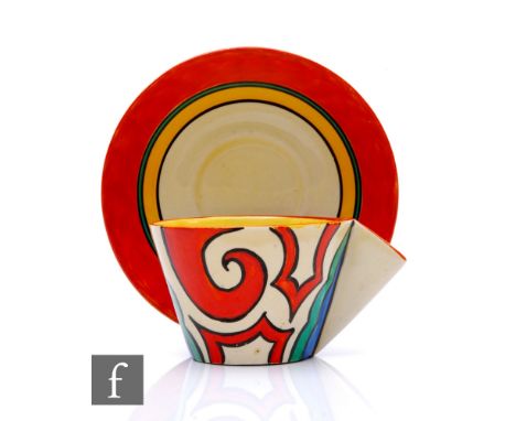 Clarice Cliff - Arabesque - A conical tea cup and saucer circa 1930, hand painted with an abstract scroll motif in red, blue 