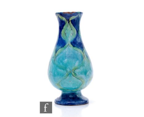 Liza Watkins - Della Robbia Pottery - An early 20th Century pottery vase of inverse baluster footed form, painted monogram re