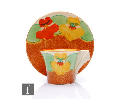 Clarice Cliff - Nasturtium - A Daffodil shape coffee cup and saucer circa 1932, hand painted with a band of flowers and folia