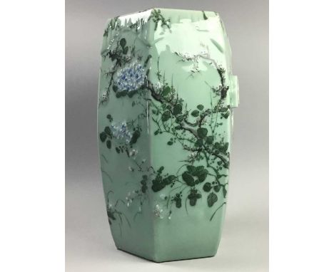 20TH CENTURY CHINESE CERAMIC SEAT,painted with birds and foliage on a green ground, 50cm high