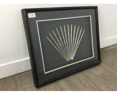 DISPLAY OF TWELVE CHINESE WHITE METAL CHOPSTICKS,bearing engraved decoration, mounted, framed and under glass, 42 x 52.5cm, t