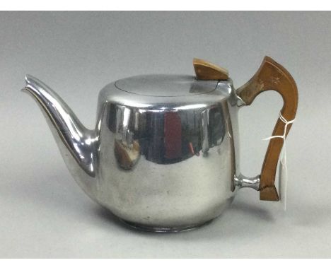 PICQUOT WARE FOUR PIECE TEA SERVICE,comprising teapot, cream jug, sugar and hot water pot, on tray