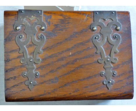 A vintage oak and brass money box-5"x4"x3"- in very good condition