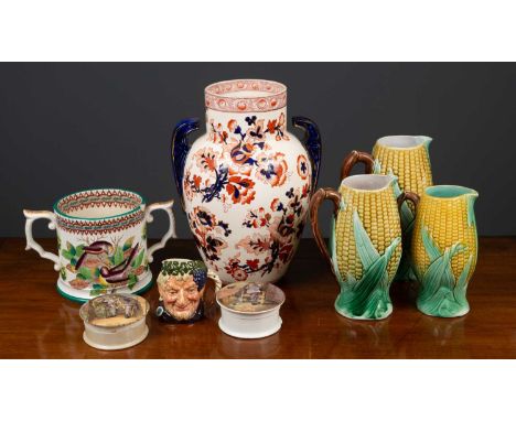 A group of three ceramic jugs possibly by George Jones formed as corn on the cobb, the largest 24cm high; two ceramic boxes w