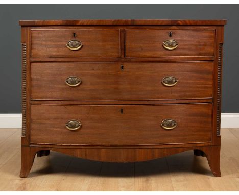 A George III mahogany bow front chest of two short and two long drawers with brass handles and splayed bracket feet, 108.5cm 