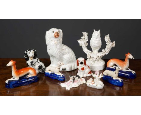 A collection of decorative ceramic dogs to include two pairs of Greyhounds formed as pen holders, 13cm high and 9cm high; a K