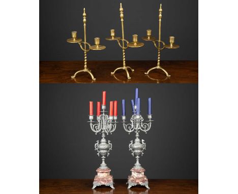 A set of three brass adjustable double candlesticks on turned column and tripod base, 36.5cm high together with a pair of fiv