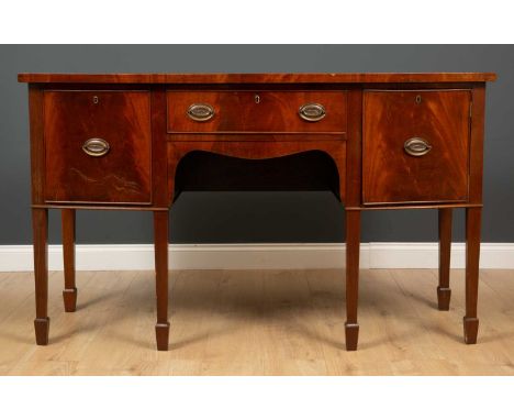 A Georgian style mahogany bow front sideboard the central drawer flanked by cupboards, 153cm wide x 61cm deep x 68.5cm highCo