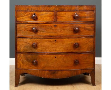 A Victorian mahogany and satinwood inlay bow fronted chest, of two short over three long drawers, with carved apron on bracke