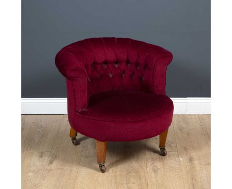 A late Victorian upholstered tub chair with square tapering legs and brass and ceramic casters, 71cm wide x 62cm deep x 33cm 