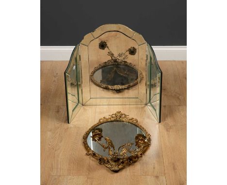 A gilt metal two light girandole wall mirror with rope twist and curving foliate decoration to the rim, 36cm wide x 47cm high