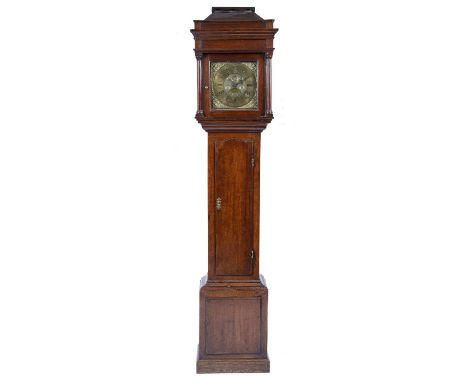 A George III oak longcase clock, the hood with caddy top and turned pillars, the brass dial with moon phase and date aperture