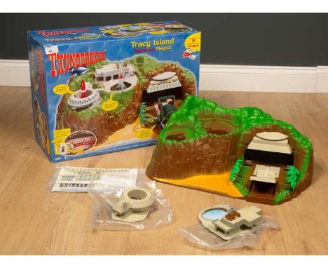 A collection of toys to include a Thunderbirds Tracy Island electronic playset by Carlton (parts missing, ships missing) toge