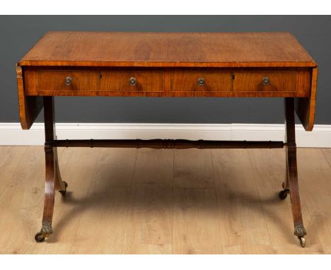 A Regency rosewood sofa table with crossbanded top, two frieze drawers, opposing dummy drawers and splayed legs, 159cm x 69cm