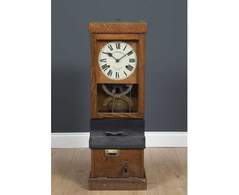 A National Time Recorder Co Limited clocking in and out timepiece with enamelled roman numeral dial behind glass with clockin