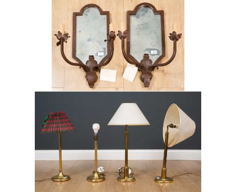 A pair of cast iron mirror backed two light girandoles with foliate decoration, 25cm wide x 60cm high; four brass lamps; a pa