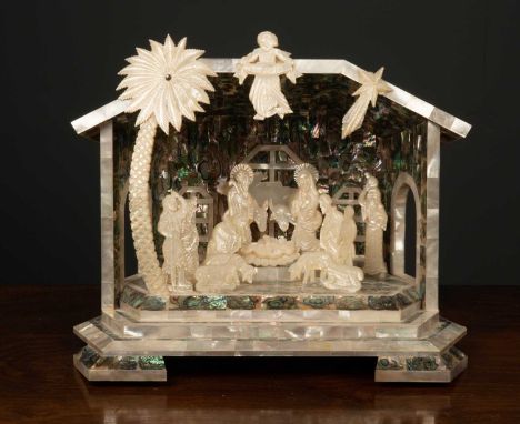 A mother of pearl nativity scene 33cm wide x 27cm high in a fitted boxCondition report: In good condition, one loose figure