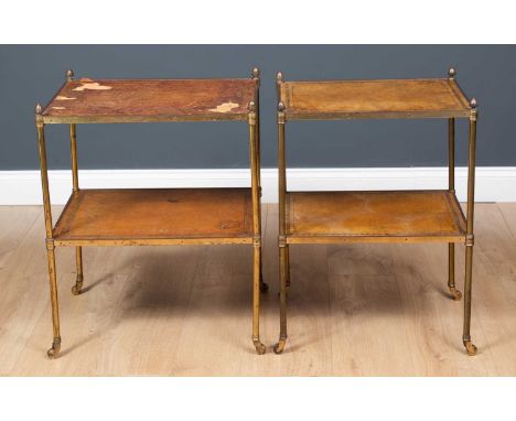 A near pair of brass two tier occasional tables with leather inset tops to the two tiers, all on brass casters, 47cm wide x 3