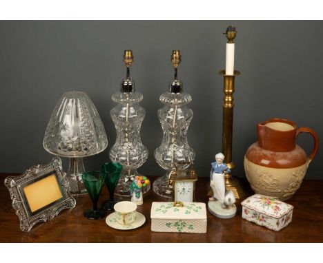 A pair of cut glass table lamps each 46cm high; a further cut glass table lamp; a carriage timepiece by L'Epee; a Belleek por