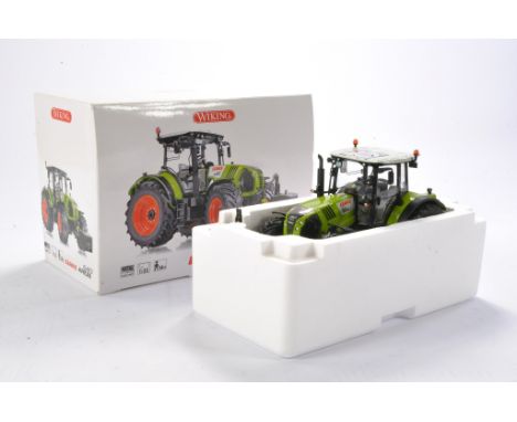 Farm model interest comprising Wiking 1/32 Claas Arion 640 Tractor. Looks to be excellent and without obvious sign of fault i