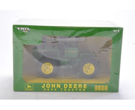 Farm model interest comprising Ertl Britains 1/32 John Deere 8630 Tractor. Looks to be excellent and without obvious sign of 