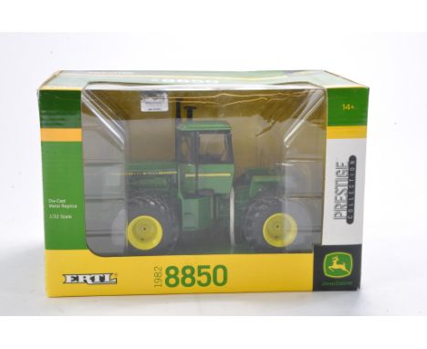 Farm model interest comprising Ertl 1/32 John Deere 1982 8850 Tractor. Prestige Collection. Looks to be excellent and without