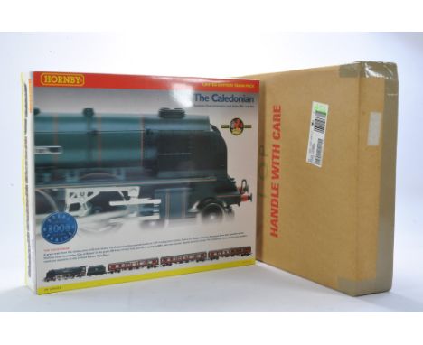 Model Railway Comprising Hornby No. R2112 The Caledonian Duchess Class Locomotive And Three MKl Coaches. Limited Edition Trai