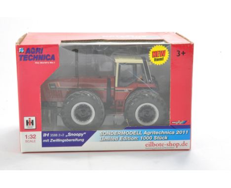 Farm model interest comprising Britains 1/32 IH 3588 2 + 2 Snoopy Tractor  - Limited Edition. Looks to be excellent and witho